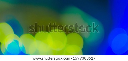 Abstract Bokeh Blue and green background of defocused glittering lights. Christmas, Party, New Year background pattern concept. banner