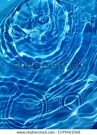 The sunlight reflected with surface waves of blue water in the deep sea