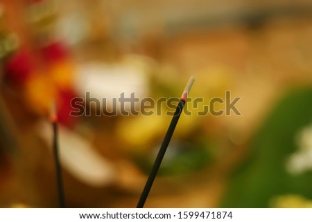Incense stick and smoke from incense burning. Beautiful smoke. Blurred background and design with copy space. Indian prayer light
