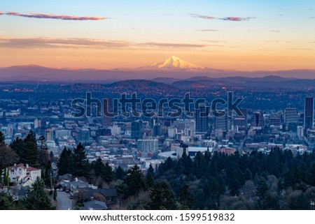 Portland, Oregon, USA. View of Portland City and Mount Hood in the winter sunset, seen from Portland Heights, toward east.