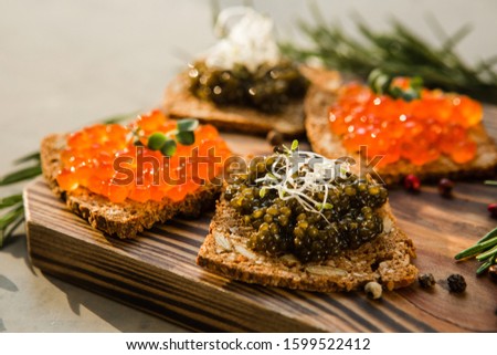 chic expensive red caviar, pike caviar and black caviar for a snack
