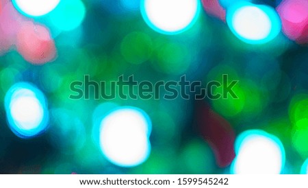 Blurred abstract Christmas lights garland background. A modern material for key visual design.