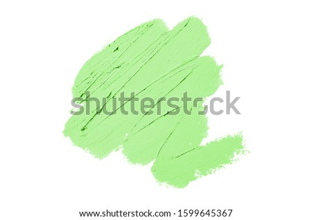 Smear and texture of lipstick or acrylic paint isolated on white background. Stroke of lipgloss or liquid nail polish swatch smudge sample. Element for beauty cosmetic design. Green color