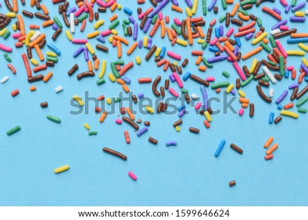 Colorful sprinkles on a blue background