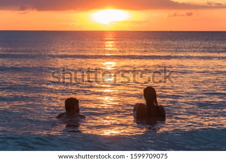 A young Couple watching the Sunset