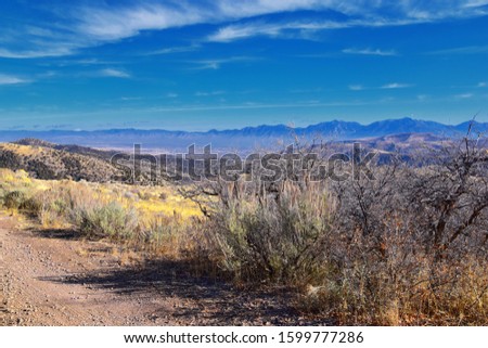 Views of Wasatch Front Rocky Mountains from the Oquirrh Mountains with fall leaves, Hiking in Yellow Fork trail and Rose Canyon in Great Salt Lake Valley. Utah, United States. USA.