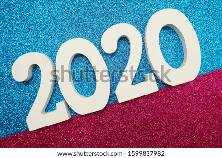 Happy New year 2020 with space copy on pink and blue glitter background