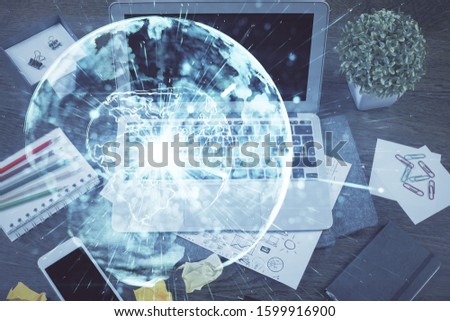 Multi exposure of business theme icons and work space with computer background. Concept of success.