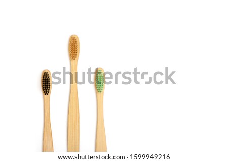Bamboo toothbrushes isolated on white background with copy space.