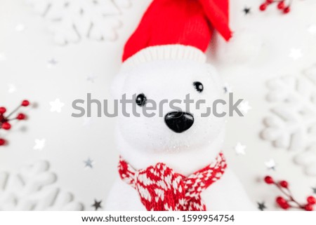 Christmas winter composition with polar white bear, snowflakes and red berries on white background. Christmas gift. Christmas, new year, celebrate, winter, holidays concept
