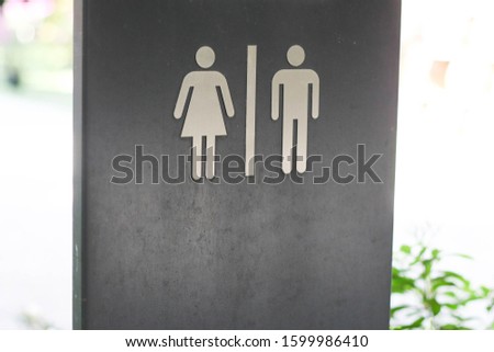 Man and woman toilet sign in public space.