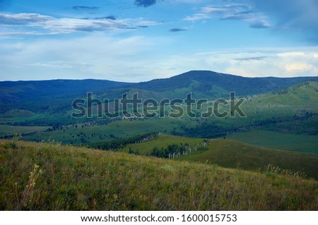 Green steppes and hills on a summer day.