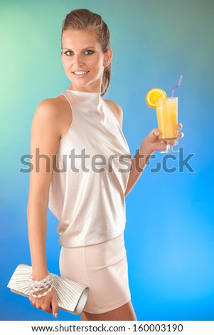 Cute young woman with cocktail