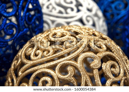Golden, blue and white christmas decorations close up