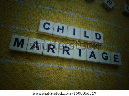 Child Marriage, word cube with background. Royalty-Free Stock Photo #1600066519