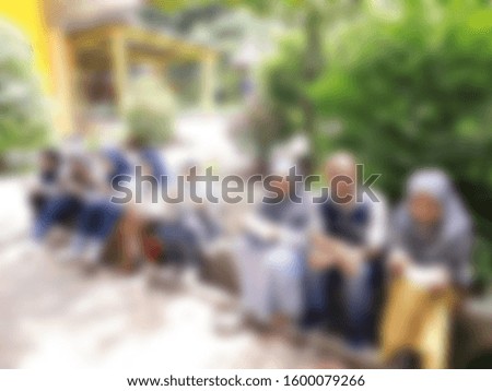Blurred abstract background of happy diverse people gathered in summer cafe, asian people standing cuddling with others people glad to see each other after long separation 