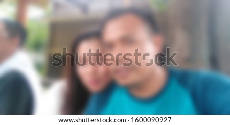 Blurred abstract background of happy diverse people gathered in summer cafe, asian people standing cuddling with others people glad to see each other after long separation 