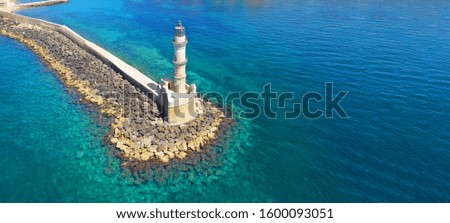Aerial drone ultra wide photo of iconic landmark lighthouse in port entrance of Hania or Chania, Crete island, Greece