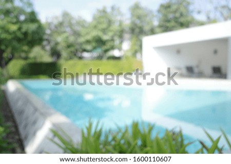 Blur focus of Swimming pool and modern building.Blur focus of Swimming pool and modern building