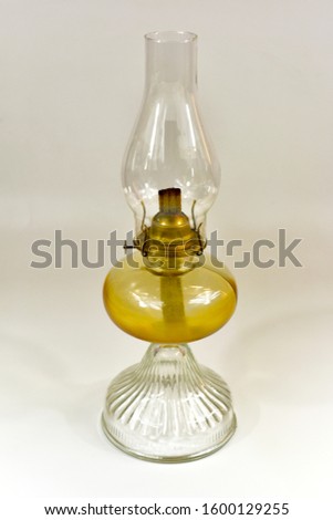 Retro vintage glass oil lamp on a white background