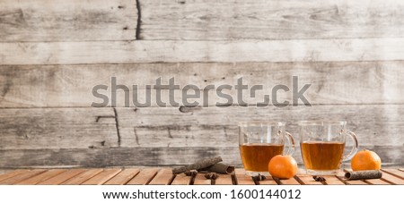 Festive time with home made cookies on the wodden table with wooden background