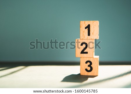 Wooden block number using as business competition concept Royalty-Free Stock Photo #1600145785