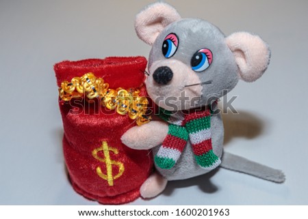 The mouse with a bag of gifts as a symbol of the new year by the Eastern calendar. Gray mouse on a white background.