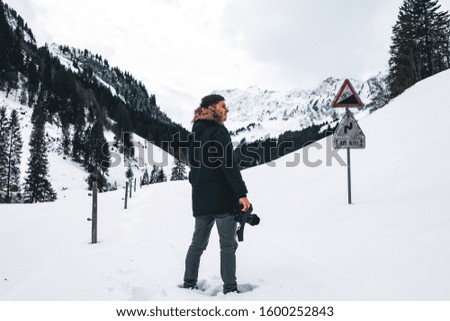 A Photographer In The Snow, Switzerland.