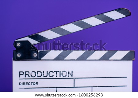 video production movie clapper cinema action and cut concept isolated on purple violet background