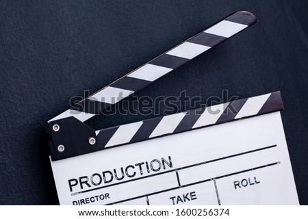 video production movie clapper cinema action and cut concept on black chalkboard background