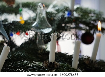 White Wax Candle Blow Off. Smoke From The Blown Out Candles. Christmas Tree And Candle Light. Beautiful Festive Background.