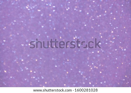 Festive Violet Background with Star Shaped Bokeh Effect