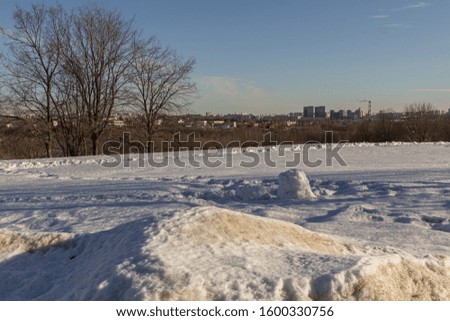 2019.02.19, Moscow, Russia. Winter landscape with city buildings on the horizon.