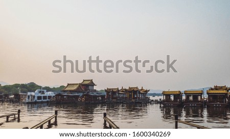 Tourist boats in dock in West Lake, in Hangzhou, China