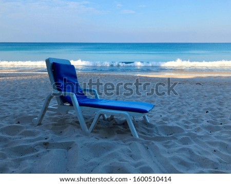 photo of sunbeds on the background of the ocean in Phuket