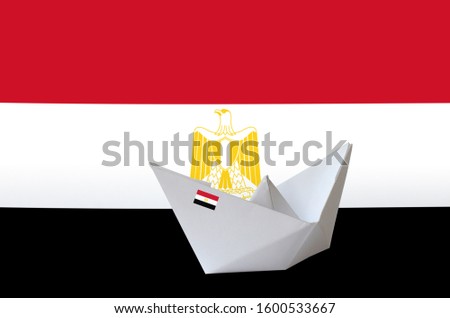 Egypt flag depicted on paper origami ship closeup. Handmade arts concept