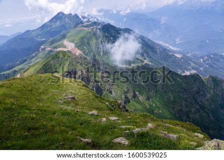 Beautiful view in the mountains near the Sochi, Krasnaya Polyana, Rosa Khutor, Caucasus range,  at an altitude of 2300 meters on a clear Sunny day