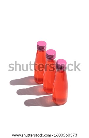 Collagen drinks with hard light isolated on white background. Beauty elixir water juice in glass bottle. Branding mock up template with copy space