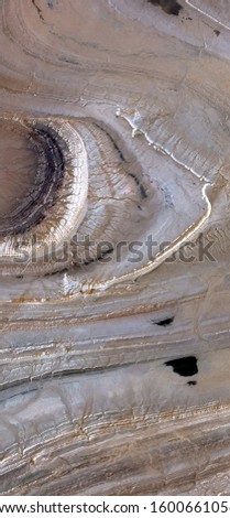 vertical abstract photography of the deserts of Africa from the air, aerial view of desert landscapes, Genre: Abstract Naturalism, from the abstract to the figurative, 