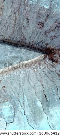 vertical abstract photography of the deserts of Africa from the air, aerial view of desert landscapes, Genre: Abstract Naturalism, from the abstract to the figurative, 
