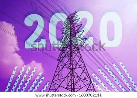 High Voltage Poles or Electric tower is transmission high voltage power with Red Background and 2020 industrial Power Energy Concept 