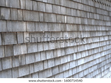 Gray cedar shingles on side of house