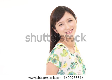 Beautiful young woman smiling isolated on white background.