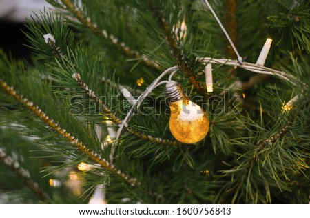 light bulb garland on christmas tree