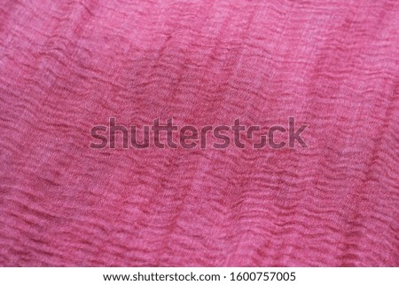 Texture, background, pattern, collection, crumpled silk fabric (pink). 3D pleated, wrinkled and cracked light pink color pure silk fabric.