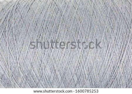 background of light gray wool on a cone