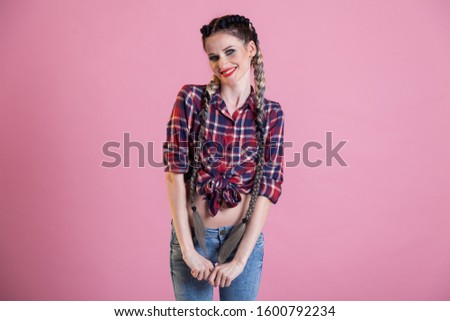 Portrait of a beautiful fashionable woman with country shirt braids