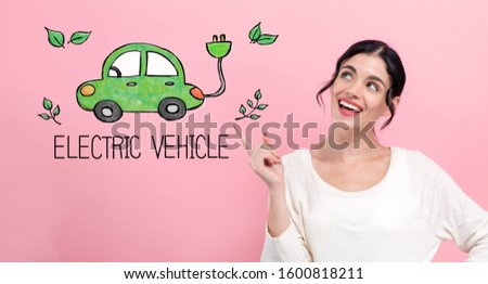 Electric car with happy young woman pointing