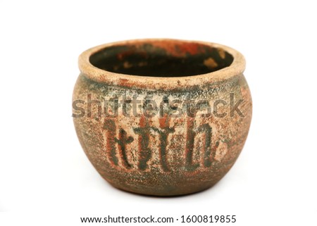 Clay old pot made by hand from clay isolated on white background. Double burning. Handmade clay pot on a white background.
 Royalty-Free Stock Photo #1600819855