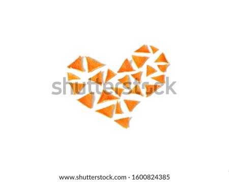 Heart of triangular pieces of Mandarin peel on a white background